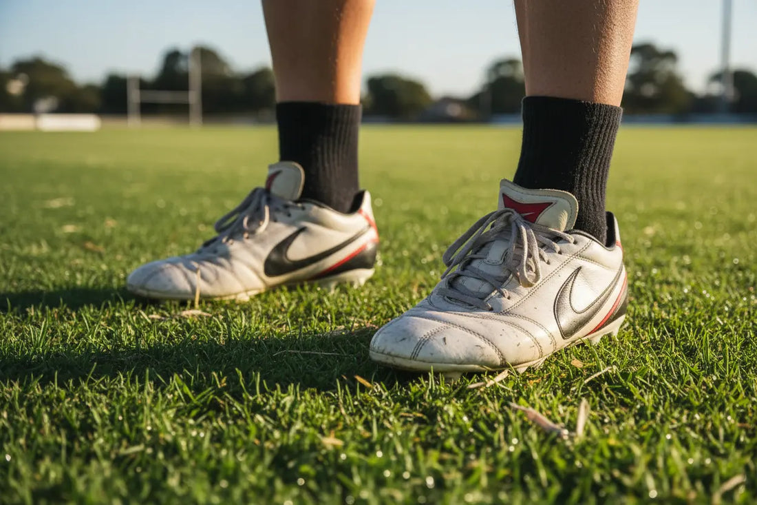 AFL football boots on grass oval — foot health and ingrown toenail care for Australian Rules Football players